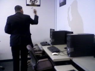 Bishop Hugo blessing one of the corners in a classroom.